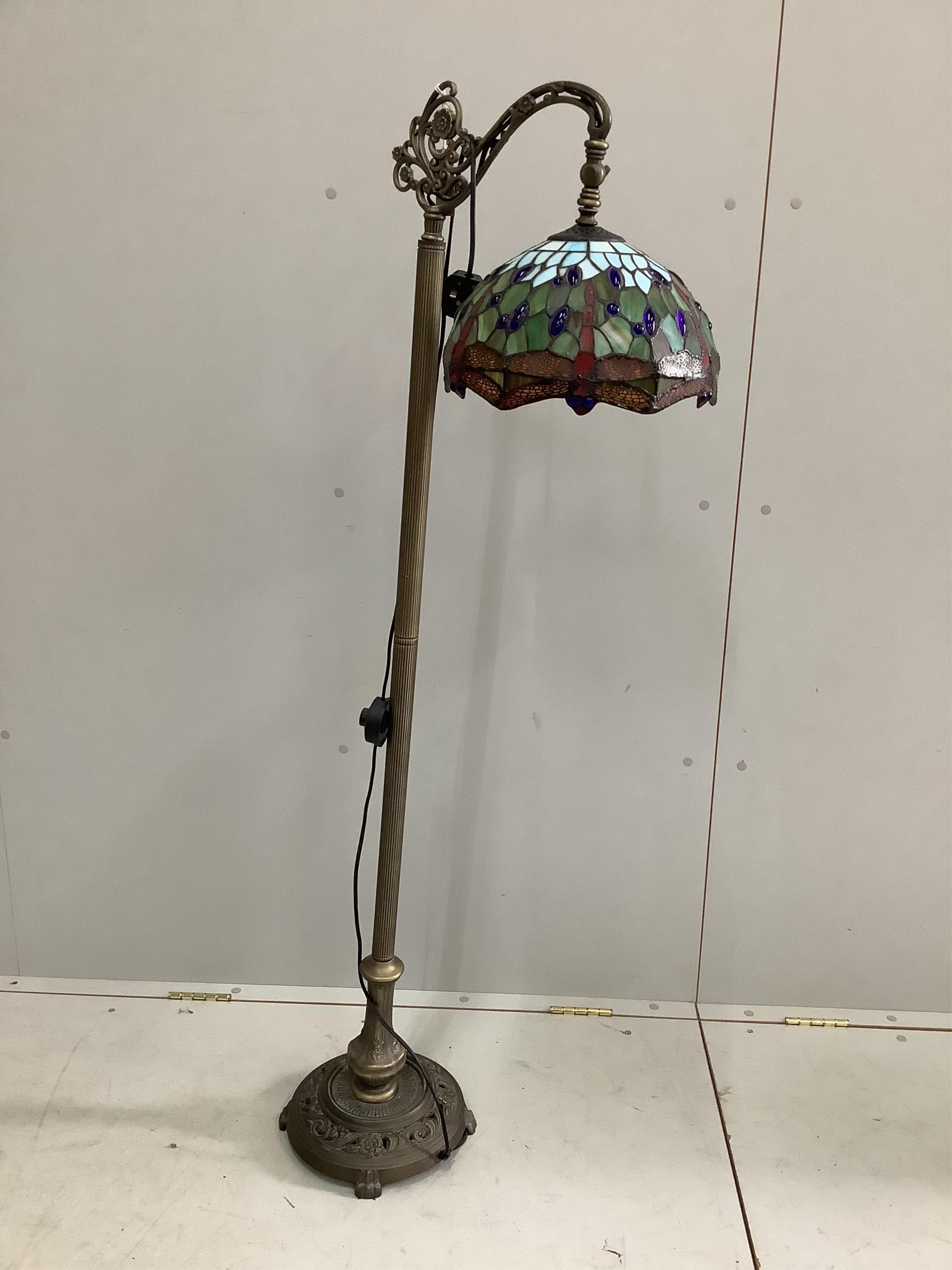 A reproduction Tiffany style standard lamp with dragonfly shade, height 144cm. Condition - good